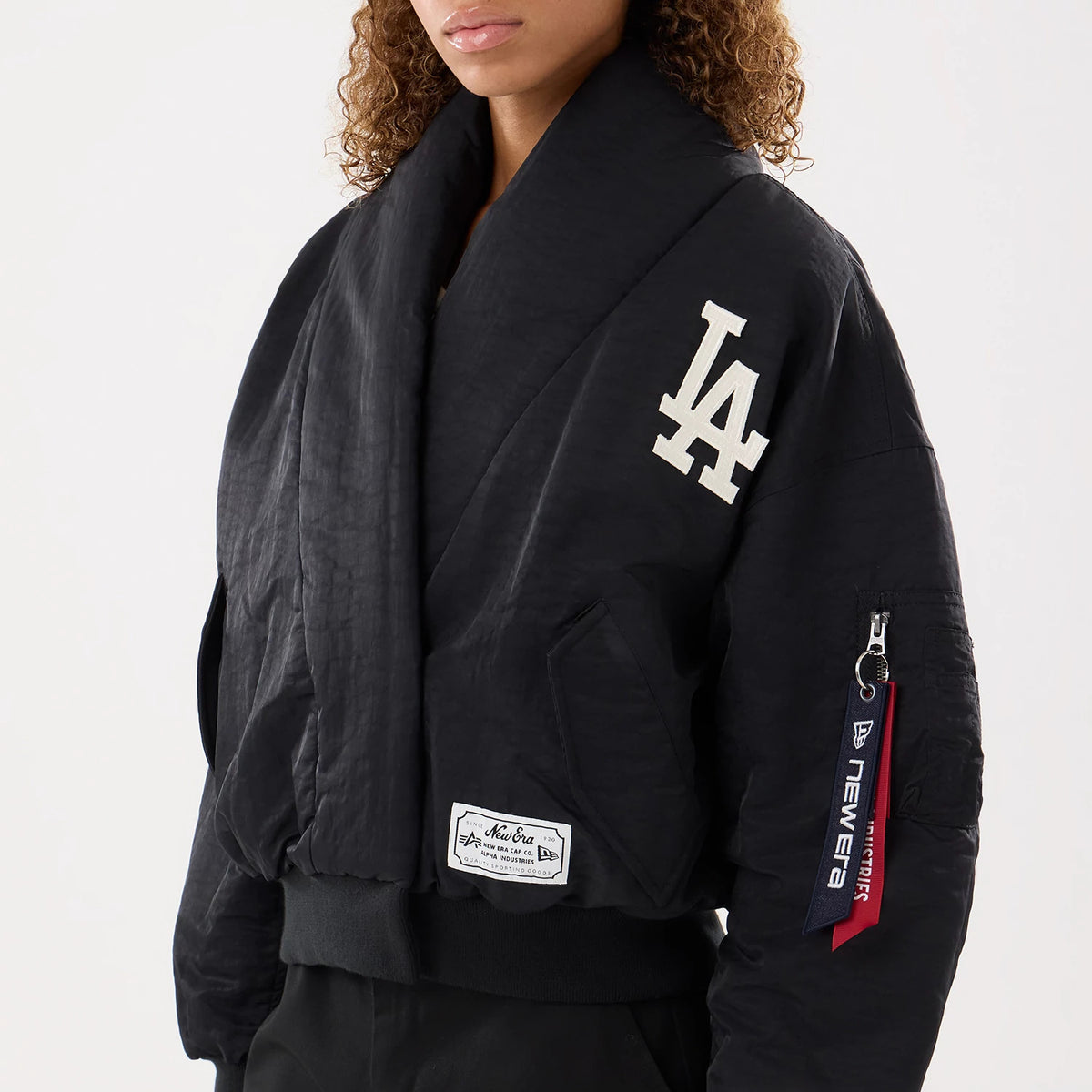 The model is wearing this MLB X Alpha LA Dodgers Jacket in black. 4