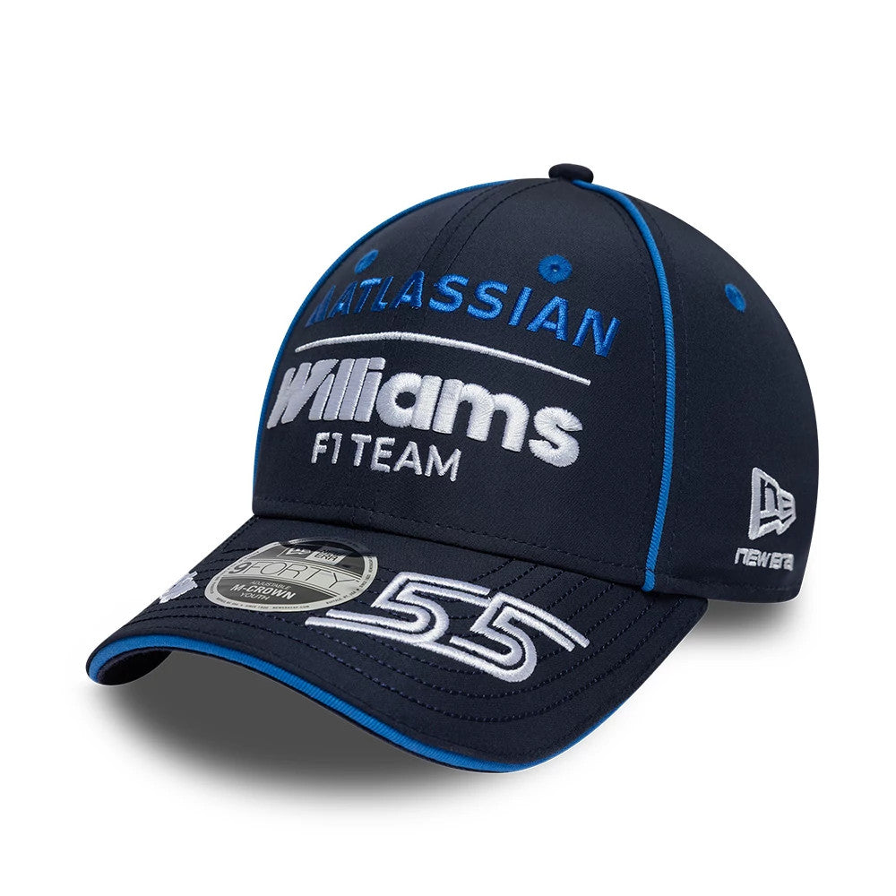 Youth Williams Carlos Sainz Navy New Era 9FORTY M-Crown Adjustable Cap, three-quarter view showing the raised white Williams F1 Team logo and number 55 on the navy curved visor, blue top button, and New Era flag logo on the left side.