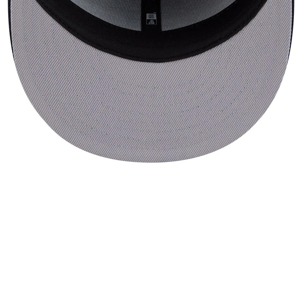 New York Yankees MLB Rhinestone Badge Navy New Era 59FIFTY Fitted Cap, inside view showing a light grey undervisor with fine linear stitching, a black sweatband lining the edge, and black taping across the structured crown.