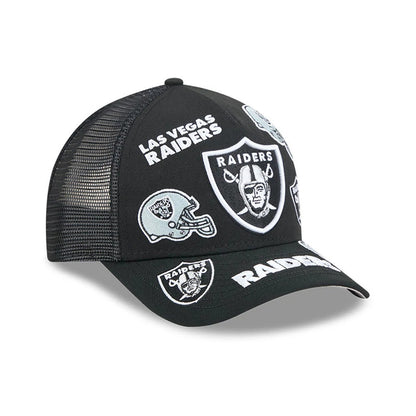 Raiders NFL All Over Black New Era 9FORTY M-Crown A-Frame Trucker Adjustable Cap, front view showing multiple white embroidered Raiders logos and text across the structured black front panel and curved black visor with mesh side panels.