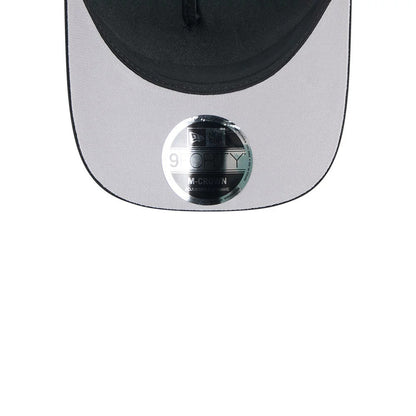Raiders NFL All Over Black New Era 9FORTY M-Crown A-Frame Trucker Adjustable Cap, close-up showing a black curved visor with a grey undervisor, featuring a reflective 9FORTY size sticker prominently placed at the centre.