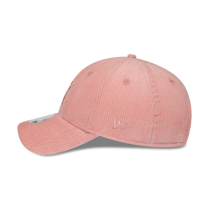 New York Yankees Womens MLB Pastel Cord Pink New Era 9FORTY M-Crown Adjustable Cap, side view showing the pink embroidered New Era flag logo on the left side, with a structured corduroy crown, curved visor and a 9FORTY size sticker on the visor.