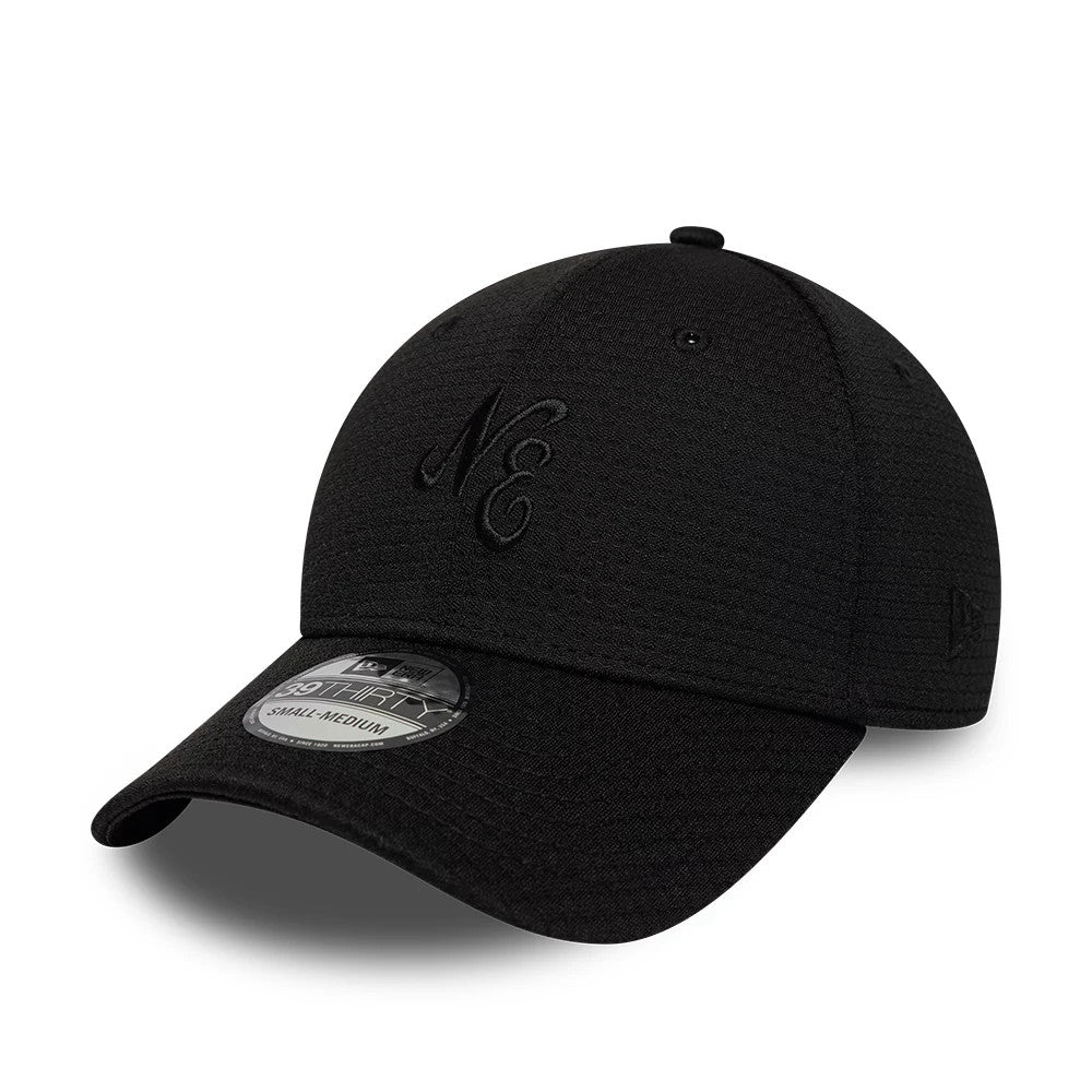 New Era Tech Black 39THIRTY Stretch Fit Cap, three-quarter view showing black raised embroidered NE lettering on the front panel, a textured black curved visor with a 39THIRTY size sticker, and the black New Era flag logo on the left side.