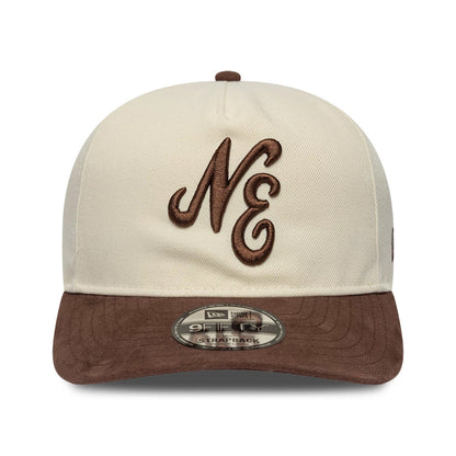 New Era Suede Visor Cream New Era 9FIFTY A-Frame Adjustable Cap, front view showing the brown embroidered NE logo on the cream front panel, a brown suede visor, and a 9FIFTY size sticker placed centrally on the visor.