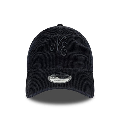 New Era Washed Cord Black 9TWENTY Adjustable Cap, front view showing the raised embroidery of the NE logo on the structured black corduroy crown, with a 9TWENTY size sticker on the curved visor.