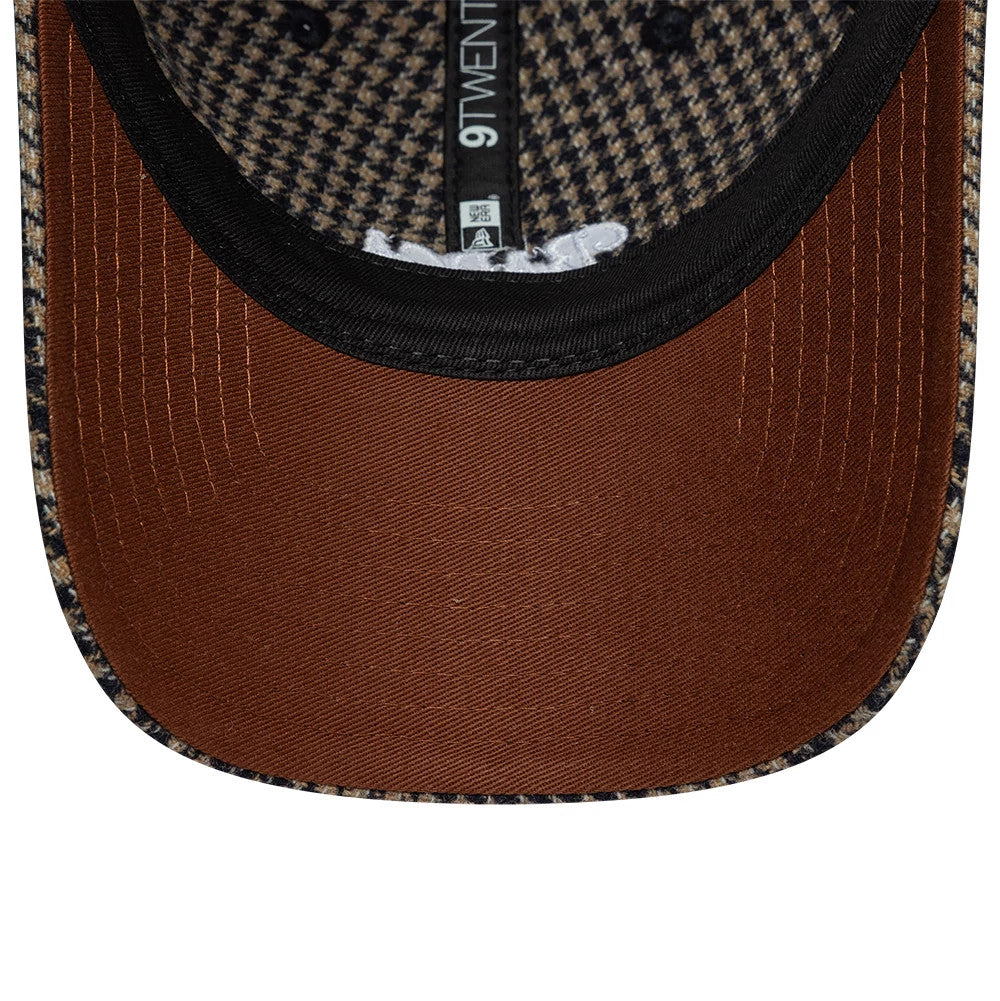 FC Barcelona Herringbone Open Brown New Era 9TWENTY Adjustable Cap, inside view showing the black 9TWENTY taping along the seam, a brown undervisor with stitching, and a textured herringbone pattern on the inner crown panels.