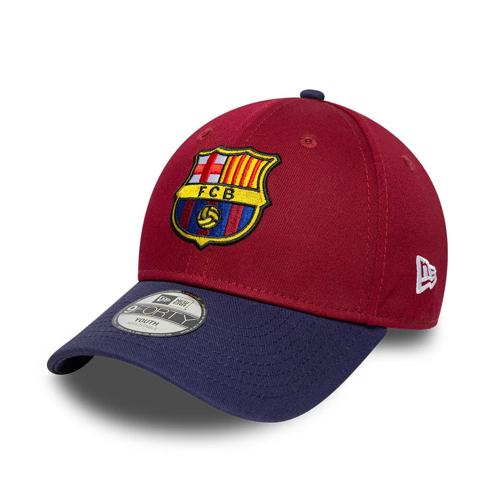 Youth FC Barcelona Contrast Dark Red New Era 9FORTY Adjustable Cap, front view showing the embroidered FC Barcelona crest in yellow, red, and blue on the structured dark red crown, with a contrasting navy visor and grey 9FORTY size sticker.