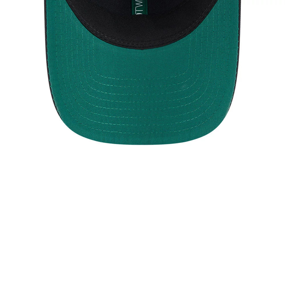 New Era Recycled Twill Black 9TWENTY Adjustable Cap, inside view showing a green undervisor with clear stitching details, black sweatband, and inner taping with New Era branding between the panels.