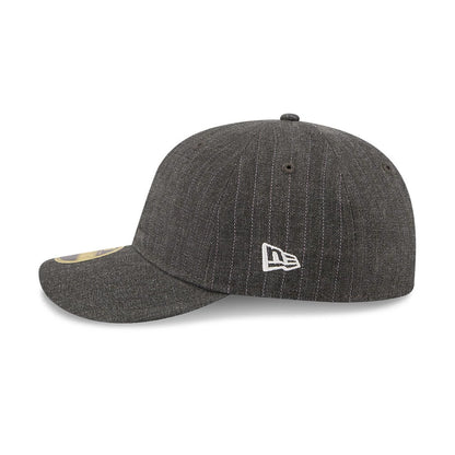 New Era Herringbone Charcoal Retro Crown 59FIFTY Fitted Cap, side view with the white New Era flag logo embroidered on the left side, showing the structured charcoal herringbone crown and the flat visor with a gold 59FIFTY size sticker.