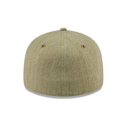 New Era Herringbone Green Retro Crown 59FIFTY Fitted Cap, rear view showing the seamless herringbone pattern on the structured green crown, with two embroidered eyelets and a matching top button.