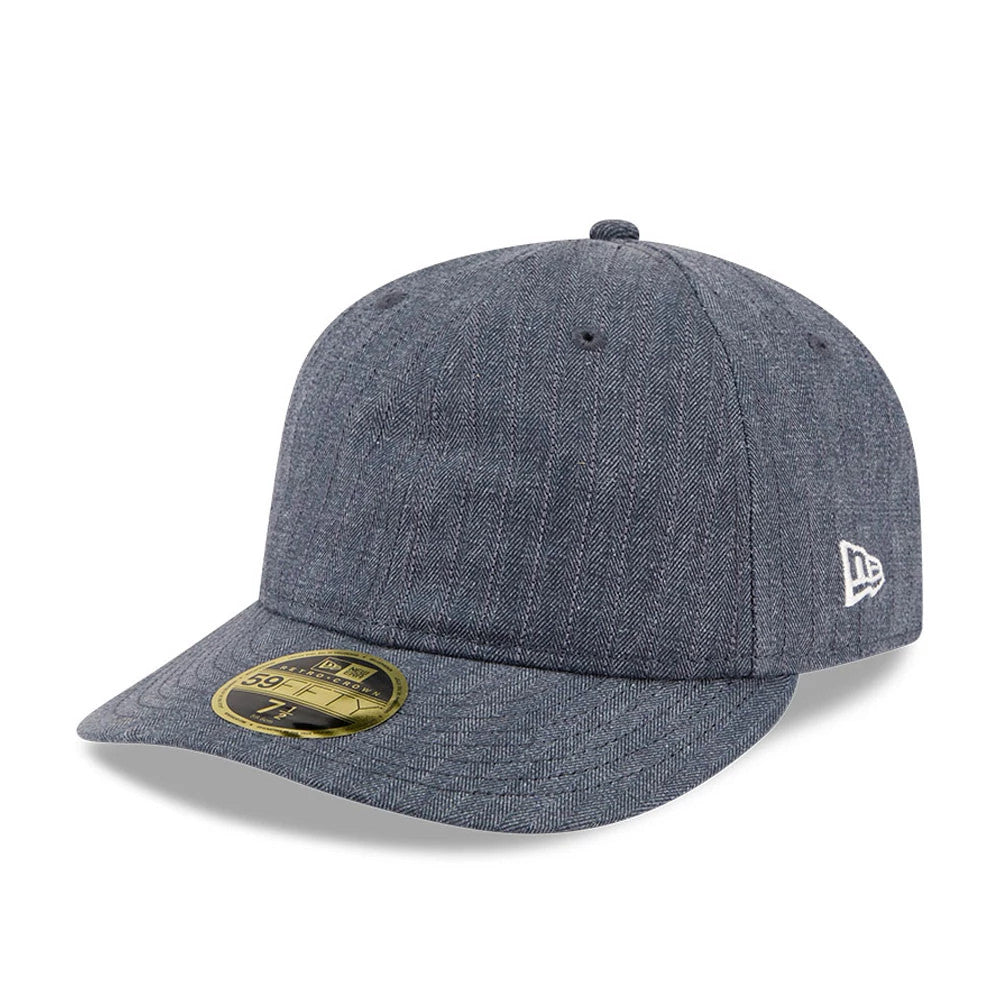 New Era Herringbone Navy Retro Crown 59FIFTY Fitted Cap, front view showing the herringbone pattern across the structured navy crown and visor, with a gold 59FIFTY size sticker on the visor.