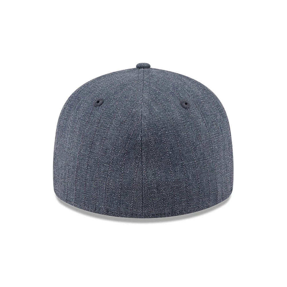 New Era Herringbone Navy Retro Crown 59FIFTY Fitted Cap, rear view showing the structured navy crown with a herringbone pattern, black embroidered eyelets, and no back logo, creating a and minimalist design.