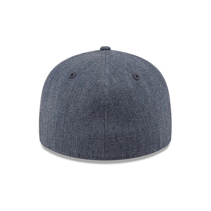 New Era Herringbone Navy Retro Crown 59FIFTY Fitted Cap, rear view showing the structured navy crown with a herringbone pattern, black embroidered eyelets, and no back logo, creating a and minimalist design.