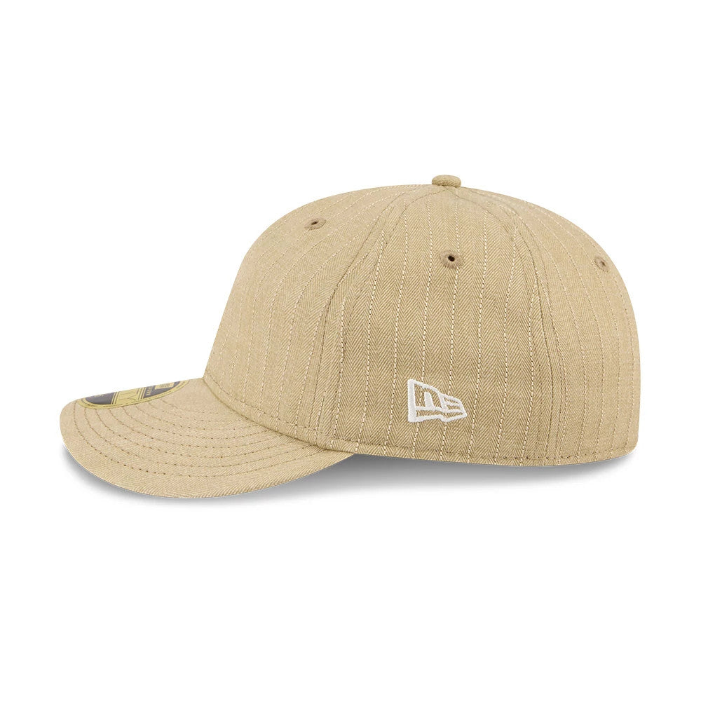 New Era Herringbone Beige Retro Crown 59FIFTY Fitted Cap, side view showing the white embroidered New Era flag logo on the structured crown, with a herringbone pattern and the gold 59FIFTY size sticker on the visor.