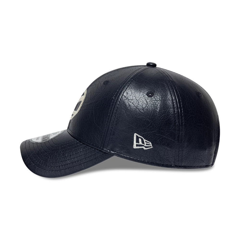 Vespa Crinkle PU Navy New Era 9FORTY Adjustable Cap, side view with a white New Era flag logo on the left side, displaying the navy crinkle-textured crown and a curved visor with a 9FORTY size sticker.