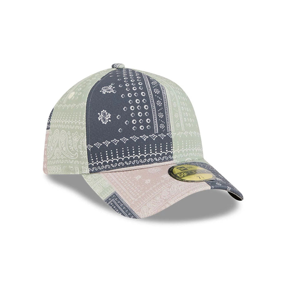 New Era Patchwork Bandana Multi 59FORTY A-Frame Fitted Cap, three-quarter view showing the intricate bandana pattern in shades of blue, green and pink, featuring a curved visor with a gold 59FORTY size sticker on top.