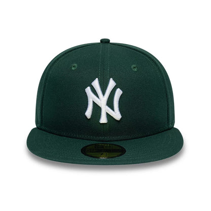 Pictured is this MLB League Essential New York Yankees 59FIFTY Fitted cap in dark green. 2