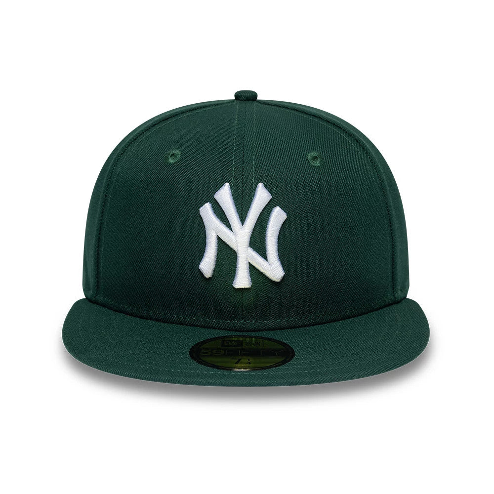 Pictured is this MLB League Essential New York Yankees 59FIFTY Fitted cap in dark green. 2