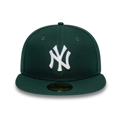Pictured is this MLB League Essential New York Yankees 59FIFTY Fitted cap in dark green. 2