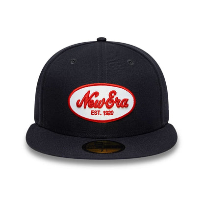 Pictured is this New Era Oval Patch 59FIFTY Fitted cap in navy. 2