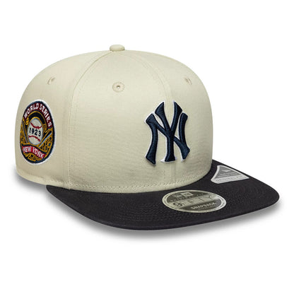 Pictured is this MLB World Series Patch New York Yankees 9FIFTY Snapback Adjustable cap in light beige. 1