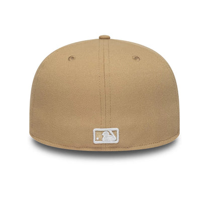New York Yankees MLB League Essential Light Beige New Era 59FIFTY Fitted Cap, rear view showing the white embroidered MLB Batterman logo at the centre back, with beige eyelets and a structured light beige crown.