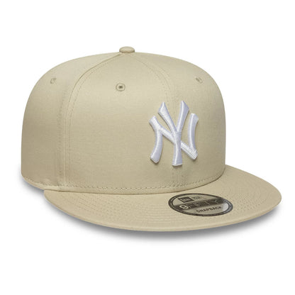 Pictured is this MLB League Essential New York Yankees 9FIFTY Snapback Adjustable cap in light beige. 3