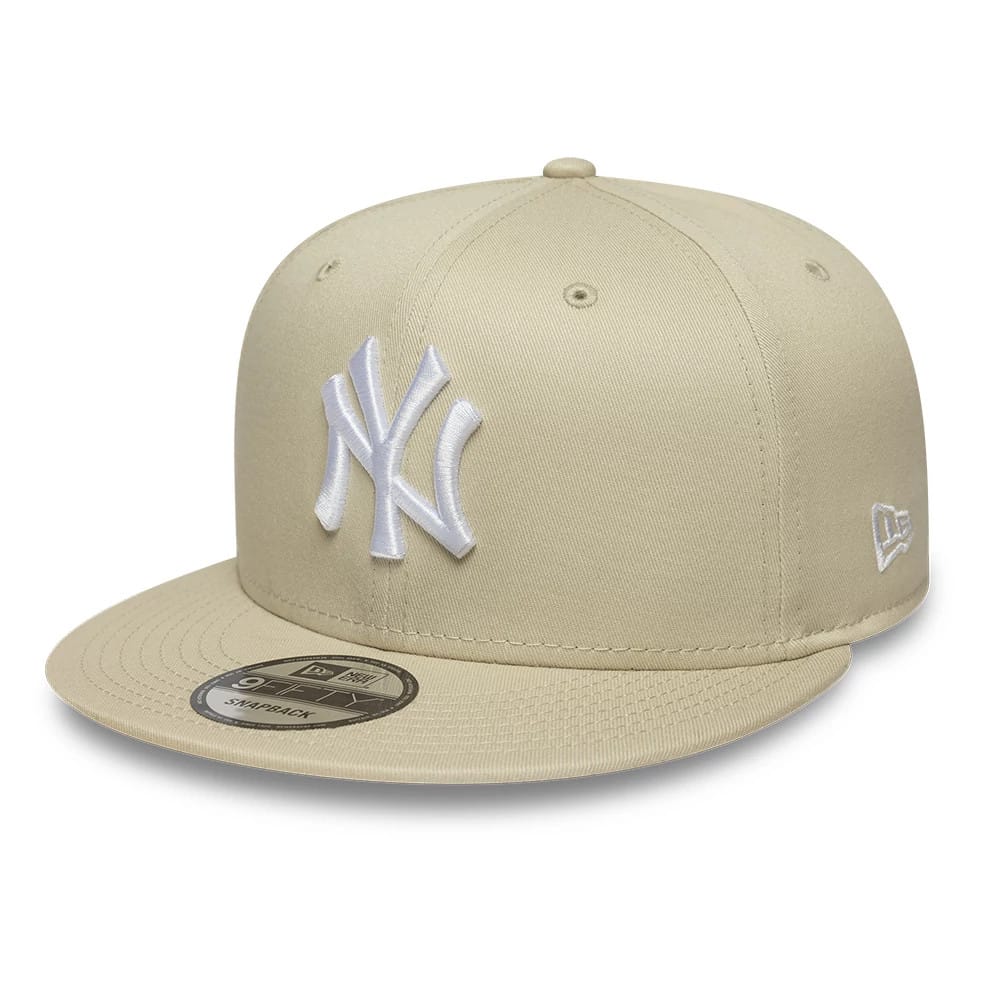 Pictured is this MLB League Essential New York Yankees 9FIFTY Snapback Adjustable cap in light beige. 1
