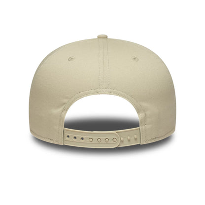 New York Yankees MLB League Essential Light Beige New Era 9FIFTY Snapback Adjustable Cap, rear view showing the structured light beige crown with matching light beige adjustable snapback closure, featuring embroidered eyelets on the back panels.