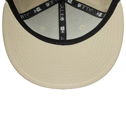 New York Yankees MLB League Essential Light Beige New Era 9FIFTY Snapback Adjustable Cap, inside view showing the black taping with 9FIFTY branding, a light beige undervisor, and black sweatband lining the light beige crown.