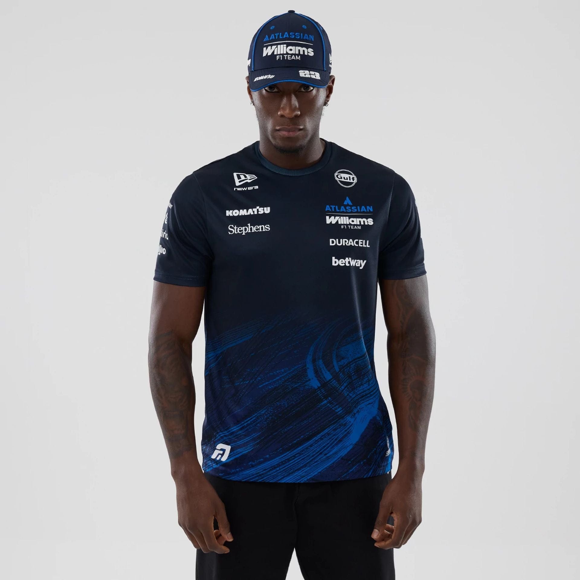 The model is wearing this Alex Albon Atlassian Williams F1 Team Tech T-shirt in navy. 1