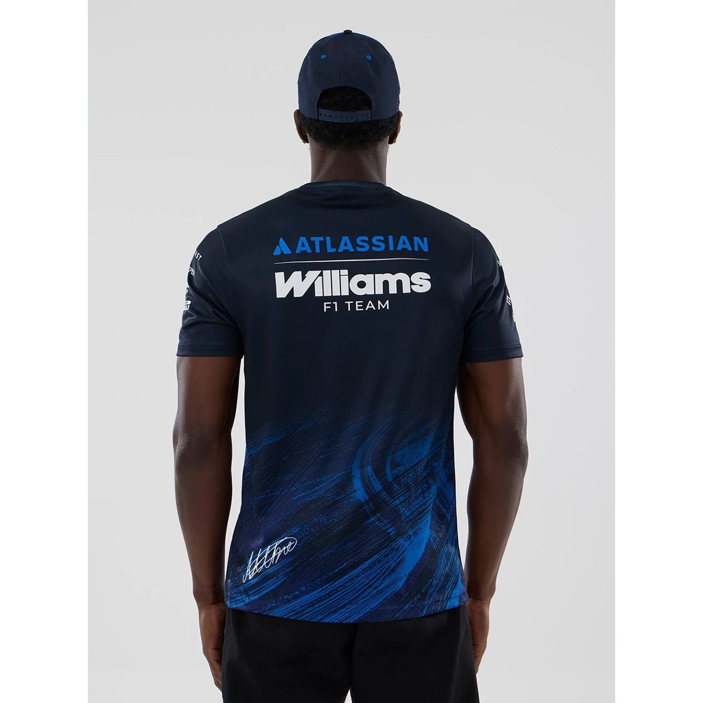 The model is wearing this Alex Albon Atlassian Williams F1 Team Tech T-shirt in navy. 2