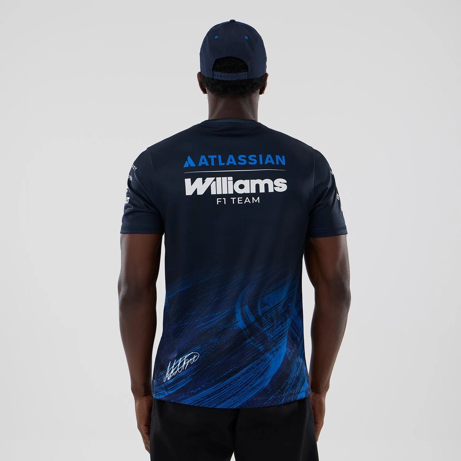 The model is wearing this Alex Albon Atlassian Williams F1 Team Tech T-shirt in navy. 2