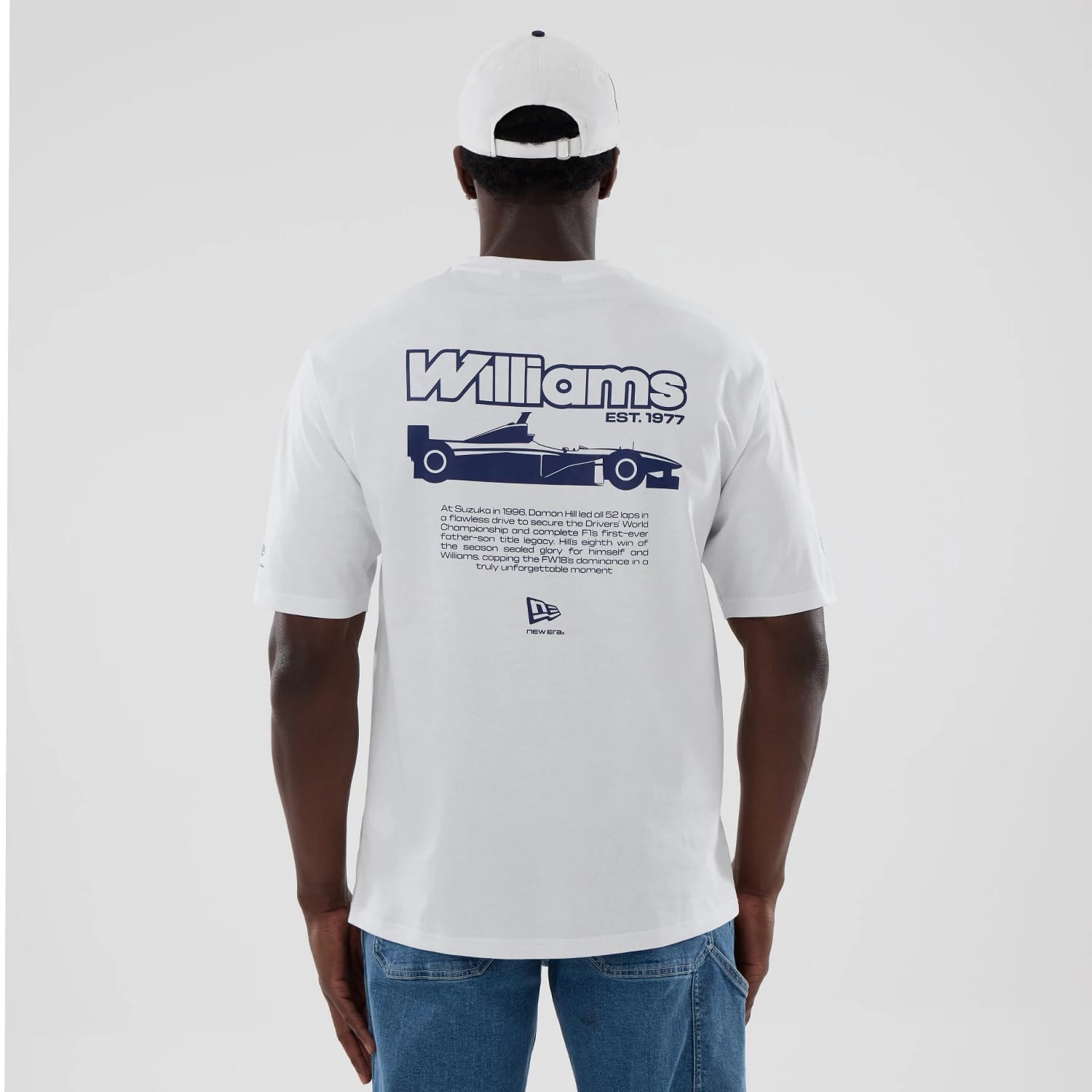The model is wearing this Atlassian Williams F1 Team Japan 1996 Script World Champions Oversized T-Shirt in white. 2