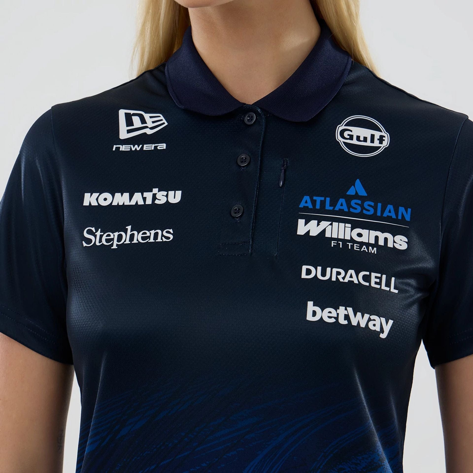 The model is wearing this Womens Atlassian Williams F1 Team Tech Polo T-shirt in navy. 3