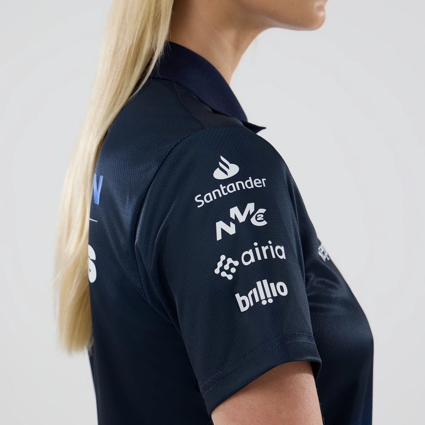 The model is wearing this Womens Atlassian Williams F1 Team Tech Polo T-shirt in navy. 5