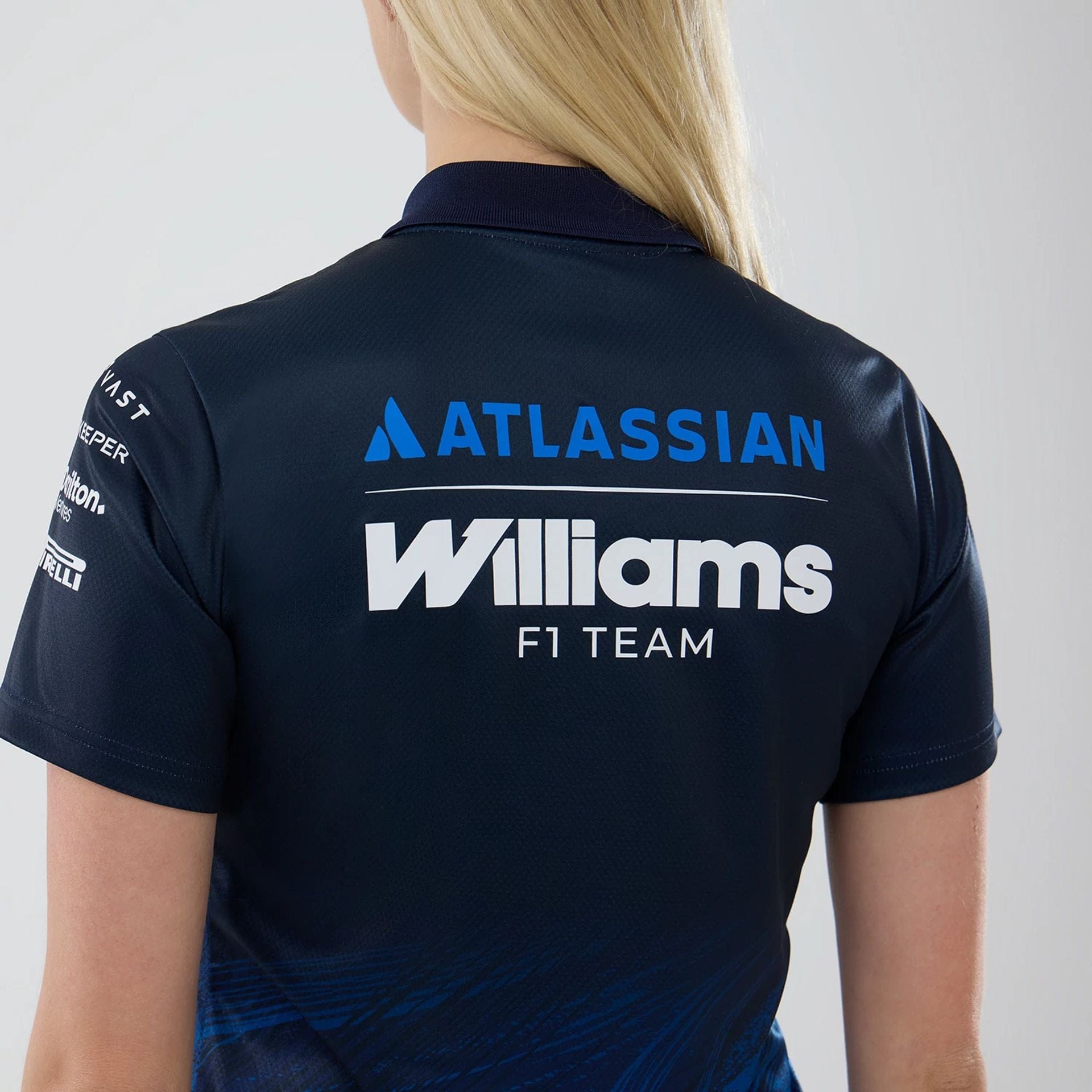 The model is wearing this Womens Atlassian Williams F1 Team Tech Polo T-shirt in navy. 6