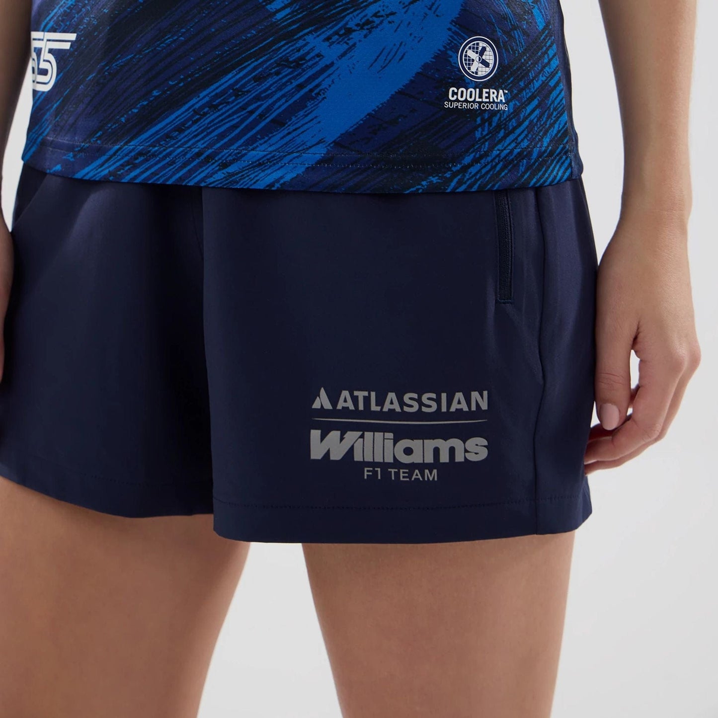 The model is wearing this Womens Carlos Sainz Atlassian Williams F1 Team Tech T-shirt in navy. 7