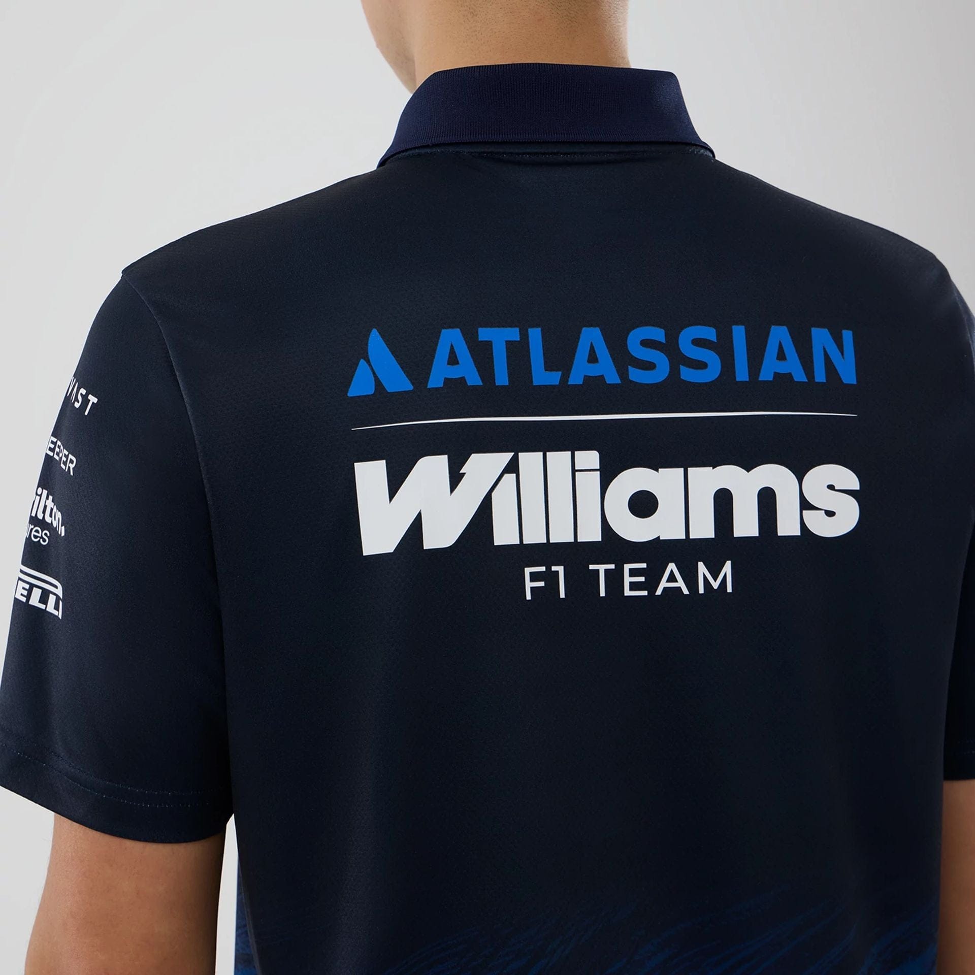 The model is wearing this Atlassian Williams F1 Team Tech Polo T-shirt in navy. 7