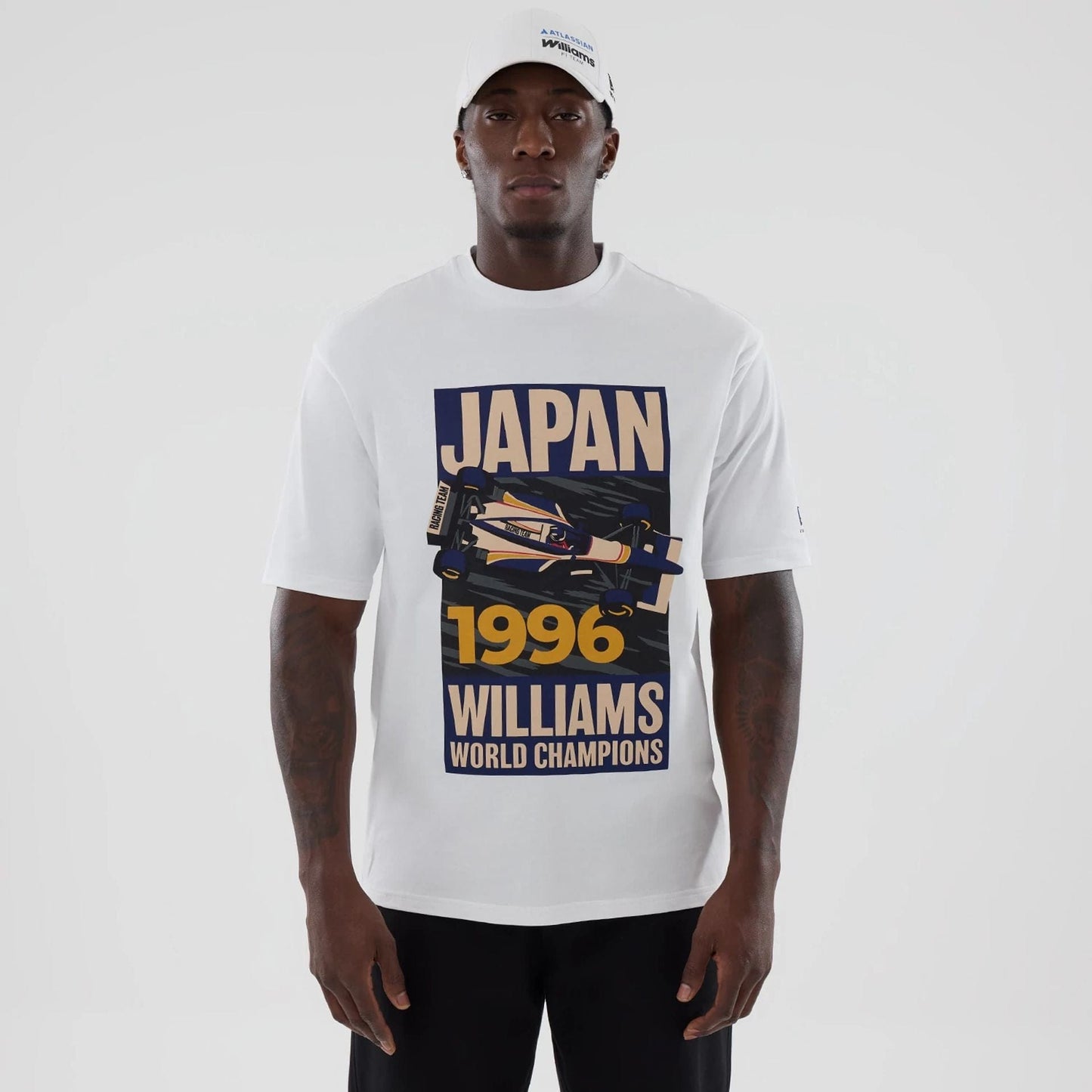 The model is wearing this Atlassian Williams F1 Team Japan 1996 World Champions Oversized T-Shirt in white. 1