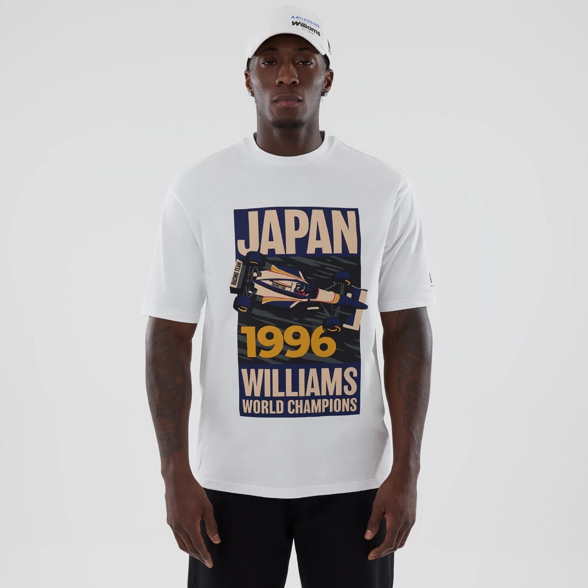 The model is wearing this Atlassian Williams F1 Team Japan 1996 World Champions Oversized T-Shirt in white. 1