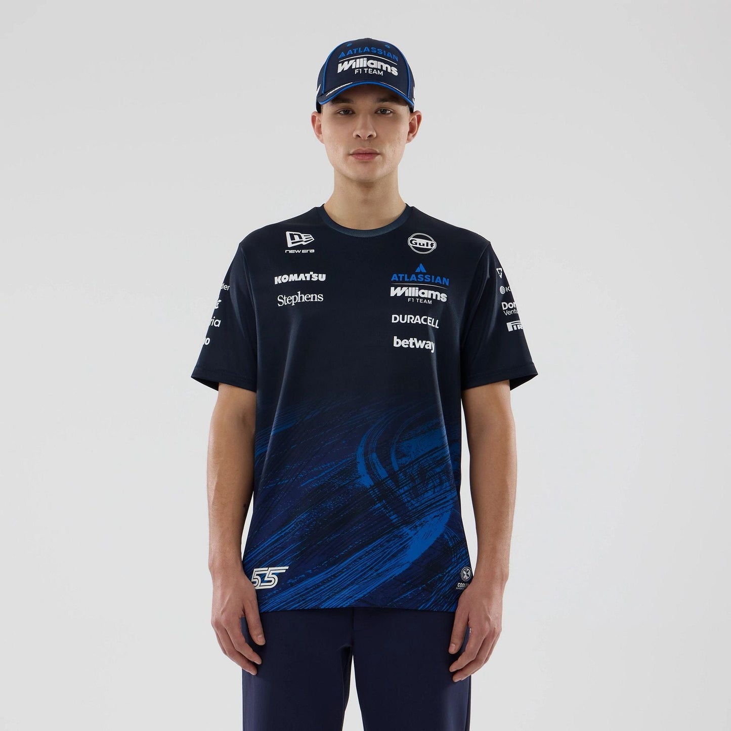 The model is wearing this Carlos Sainz Atlassian Williams F1 Team Tech T-shirt in navy. 1