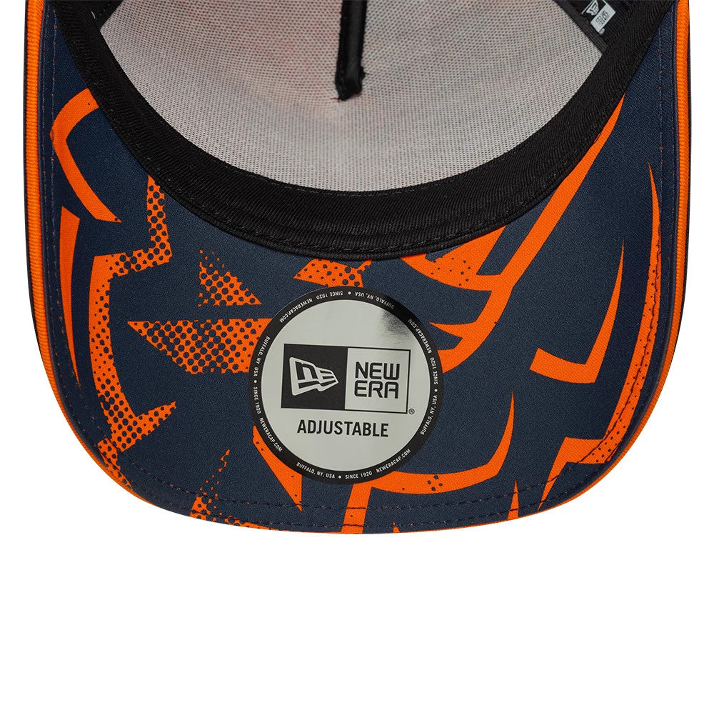 Red Bull Racing Max Verstappen Dark Blue New Era 9FORTY A-Frame Adjustable Cap, inside view showing the black sweatband, grey undervisor with an orange graphic design, and the New Era adjustable sticker centred on the underside of the visor.
