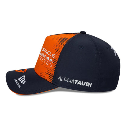 Red Bull Racing Max Verstappen Dark Blue New Era 9FORTY A-Frame Adjustable Cap, side view showing the AlphaTauri logo in white embroidery on the dark blue side panel, with a curved dark blue visor featuring the New Era flag logo.