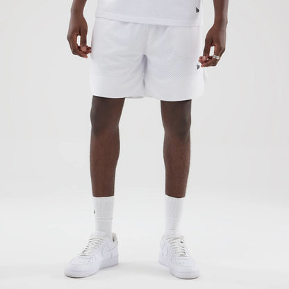 The model is wearing this New Era Mesh Oversized Shorts in white. 7