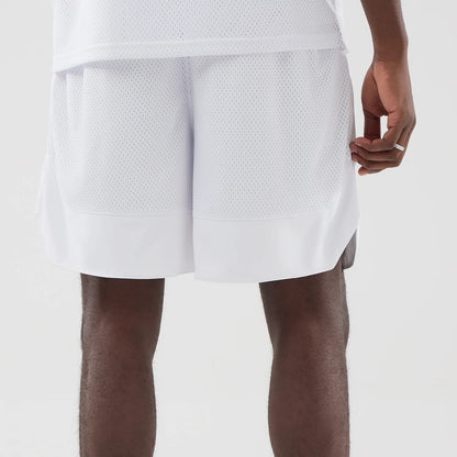 The model is wearing this New Era Mesh Oversized Shorts in white. 6