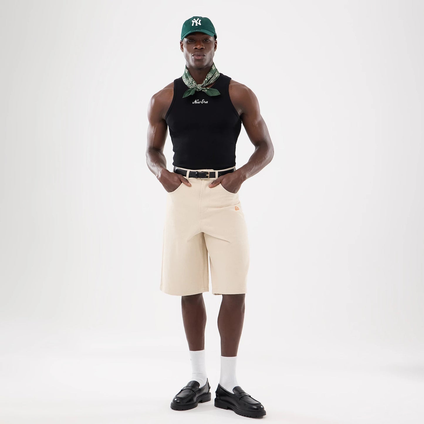 The model is wearing this New Era Rib Vest in black. 12
