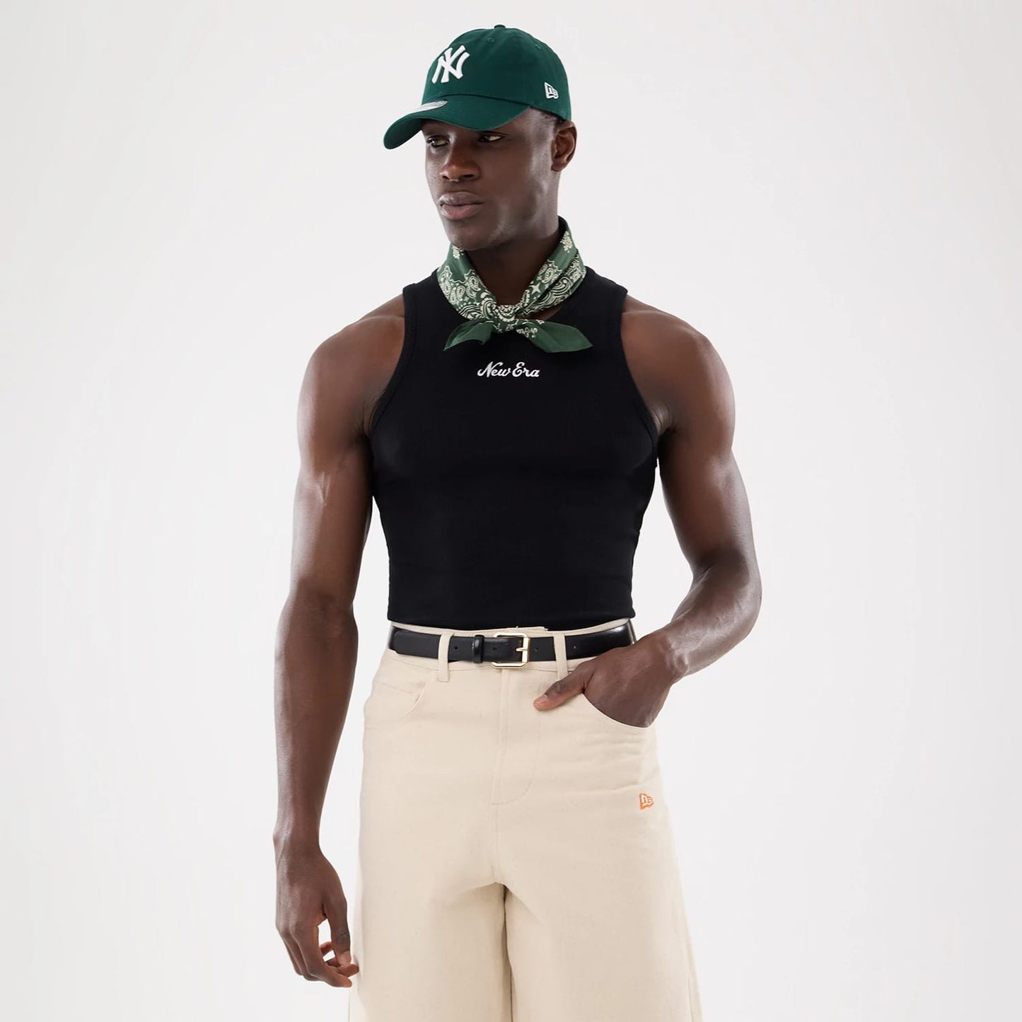 The model is wearing this New Era Rib Vest in black. 13