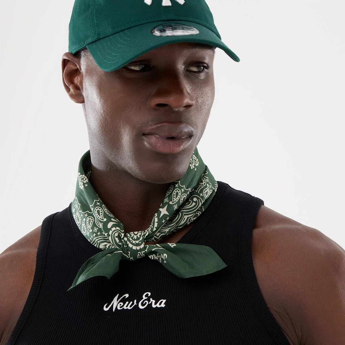 The model is wearing this New Era Rib Vest in black. 9