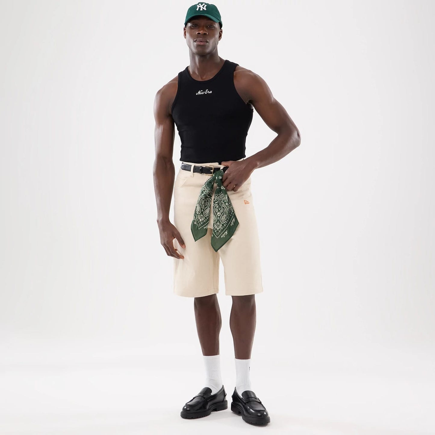 The model is wearing this New Era Rib Vest in black. 16